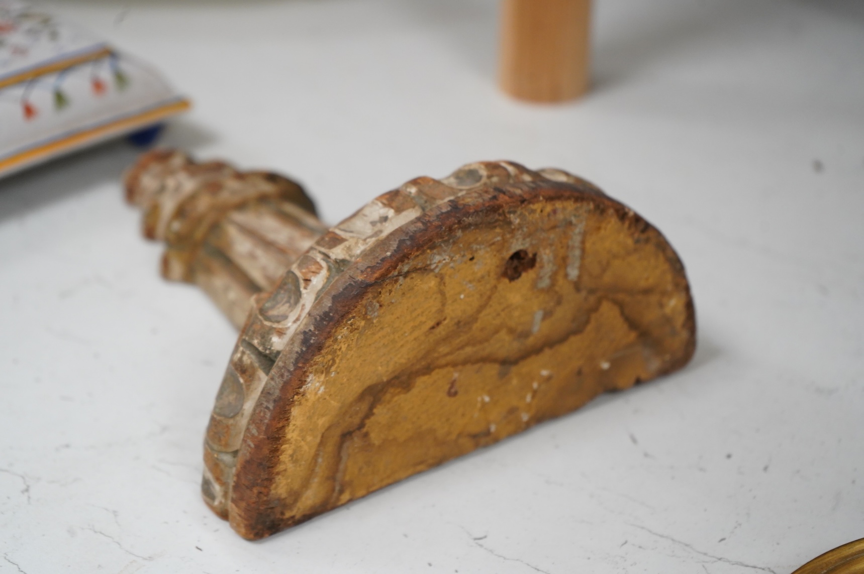 An 18th century parcel gilt carved wall bracket, 22cm high